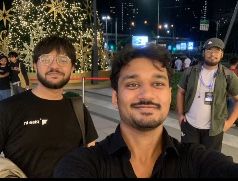 Three of us at night outside the ETHGlobal venue in Bangkok
